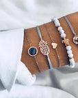 Elegant anklet bracelet featuring a star and moon design, with geometric, love, and flower elements. Includes turtle charm and beaded accents for a unique, boho-inspired look perfect for special occasions like weddings, anniversaries, and birthdays