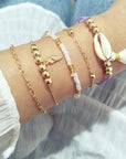 Elegant anklet bracelet featuring a star and moon design, with geometric, love, and flower elements. Includes turtle charm and beaded accents for a unique, boho-inspired look perfect for special occasions like weddings, anniversaries, and birthdays