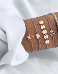 Elegant anklet bracelet featuring a star and moon design, with geometric, love, and flower elements. Includes turtle charm and beaded accents for a unique, boho-inspired look perfect for special occasions like weddings, anniversaries, and birthdays