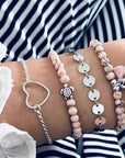 Elegant anklet bracelet featuring a star and moon design, with geometric, love, and flower elements. Includes turtle charm and beaded accents for a unique, boho-inspired look perfect for special occasions like weddings, anniversaries, and birthdays
