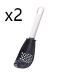 Close-up of a multifunctional slotted spoon grinding cooking spoon, showcasing its innovative design for mashing garlic, ginger, and potatoes, doubling as a stir-frying spatula and versatile kitchen gadget.