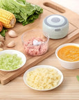 Compact USB-powered electric garlic chopper for quick meal prep. Lightweight, rechargeable mini chopper ideal for garlic and veggies. Portable, wireless design with durable and efficient performance.