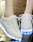 LED light-up shoes for adults and kids, featuring bright and customizable LED lights in the soles. These light shoes provide a fun and stylish way to stand out at parties, festivals, and special events. Perfect for adding a glowing touch to your wardrobe, these lighted shoes are designed for both comfort and style