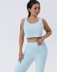 Cozy 3-piece pajama set for women, featuring a soft crop top, wide-leg pants, and a matching knee-length pullover in pastel colors.
