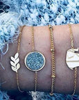 Elegant anklet bracelet featuring a star and moon design, with geometric, love, and flower elements. Includes turtle charm and beaded accents for a unique, boho-inspired look perfect for special occasions like weddings, anniversaries, and birthdays