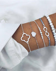 Elegant anklet bracelet featuring a star and moon design, with geometric, love, and flower elements. Includes turtle charm and beaded accents for a unique, boho-inspired look perfect for special occasions like weddings, anniversaries, and birthdays
