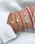 Elegant anklet bracelet featuring a star and moon design, with geometric, love, and flower elements. Includes turtle charm and beaded accents for a unique, boho-inspired look perfect for special occasions like weddings, anniversaries, and birthdays