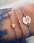 Elegant anklet bracelet featuring a star and moon design, with geometric, love, and flower elements. Includes turtle charm and beaded accents for a unique, boho-inspired look perfect for special occasions like weddings, anniversaries, and birthdays