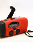 Solar hand crank radio with USB charging port, red in color. Features include a Midland Weather Alert Radio, hand crank radio flashlight, and solar charging capabilities, designed for emergency preparedness and outdoor use.