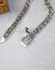 Elegant sterling silver belt bracelet with geometric design and platinum plating, featuring a unique belt buckle style.