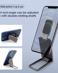 Foldable and retractable mobile phone holder with a magnetic ring buckle design. Adjustable stand suitable for desk, car, or office use, compatible with all smartphones and tablets.