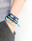 A bold statement bracelet featuring vintage punk design with metal detailing, perfect for rock chic and rebellious fashion lovers.