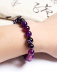 Elegant real amethyst bracelet featuring purple stone beads, perfect for adding a touch of sophistication to any outfit
