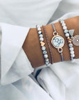 Elegant anklet bracelet featuring a star and moon design, with geometric, love, and flower elements. Includes turtle charm and beaded accents for a unique, boho-inspired look perfect for special occasions like weddings, anniversaries, and birthdays