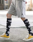 Image of a person wearing stylish travel socks with premium compression support for fatigue relief during flights.