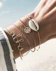 Elegant anklet bracelet featuring a star and moon design, with geometric, love, and flower elements. Includes turtle charm and beaded accents for a unique, boho-inspired look perfect for special occasions like weddings, anniversaries, and birthdays