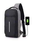 Anti-theft crossbody sling bag made from durable polyester, featuring a USB charging port, computer pocket, and soft surface. Ideal for secure storage and on-the-go charging, with a stylish, casual design and car suture detail.