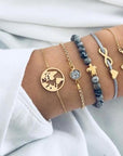 Elegant anklet bracelet featuring a star and moon design, with geometric, love, and flower elements. Includes turtle charm and beaded accents for a unique, boho-inspired look perfect for special occasions like weddings, anniversaries, and birthdays