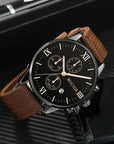 A vintage-inspired men’s professional timepiece with leather strap and a classic dial design.
