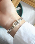 Elegant sterling silver belt bracelet with geometric design and platinum plating, featuring a unique belt buckle style.