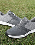 Men's lightweight, breathable golf shoes offering superior traction, comfort, and waterproof performance.