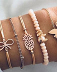 Elegant anklet bracelet featuring a star and moon design, with geometric, love, and flower elements. Includes turtle charm and beaded accents for a unique, boho-inspired look perfect for special occasions like weddings, anniversaries, and birthdays