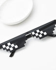 Urban-inspired sunglasses Retro pixelated sunglasses Streetwear sunglasses Bold statement eyewear Thug Life style shades Hip-hop culture sunglasses Attitude-packed sunglasses 8-bit pixel sunglasses Edgy urban eyewear Iconic street style sunglasses
