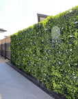 White oasis artificial vertical garden Faux vertical garden with white oasis design Artificial oasis wall panel with white foliage Decorative vertical garden featuring white oasis accents Synthetic oasis wall with lifelike white plants White oasis artificial green wall for indoor and outdoor decor Oasis-inspired artificial greenery wall with white elements Faux vertical garden panel adorned with white oasis motifs White oasis artificial plant wall for home and event decor