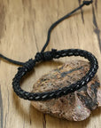 4Pcs/Set braided leather bracelets with wooden beads and rustic charms, including life tree and rudder designs, offering a vintage tribal-inspired look with braided patterns and durable leather for a stylish, ethnic accessory.