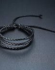 4Pcs/Set braided leather bracelets with wooden beads and rustic charms, including life tree and rudder designs, offering a vintage tribal-inspired look with braided patterns and durable leather for a stylish, ethnic accessory.