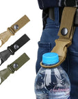 Belt backpack hanger clip Hands-free carrying clip Backpack accessory clip Belt attachment clip Outdoor gear organizer Backpack strap clip Versatile hanger clip Convenient carrying solution Hands-free carrying accessory Streamlined organization clip The Belt Backpack Hanger Clip in use during a hiking trip, holding the backpack securely on the user's belt, keeping hands free for other activities.