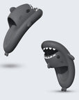 Shark slippers displayed on a living room floor, emphasizing their comfy interior and perfect fit for stay-at-home essentials.