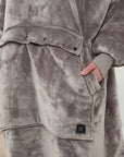 A cozy hoodie showcasing winter fashion, oversized design, and soft fabric for ultimate warmth.