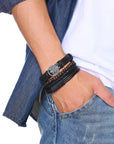 4Pcs/Set braided leather bracelets with wooden beads and rustic charms, including life tree and rudder designs, offering a vintage tribal-inspired look with braided patterns and durable leather for a stylish, ethnic accessory. Eco-friendly braided bracelets designed for stacking, versatile as friendship or couples' matching accessories