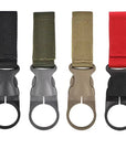 Belt backpack hanger clip Hands-free carrying clip Backpack accessory clip Belt attachment clip Outdoor gear organizer Backpack strap clip Versatile hanger clip Convenient carrying solution Hands-free carrying accessory Streamlined organization clip A traveler using the Belt Backpack Hanger Clip in a camping setting, highlighting its practicality for carrying backpacks while keeping hands free.