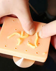 A realistic pimple popping squishy toy made from non-toxic TPE material, featuring 11 holes for stress relief.