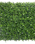 White flowering artificial boxwood wall Artificial boxwood wall with white flowers Faux boxwood wall panel with flowering white blooms Decorative boxwood backdrop with white floral accents Artificial hedge wall featuring white flowering foliage White flower boxwood wall panel for indoor and outdoor decor Lifelike artificial boxwood wall with white blossoms Faux boxwood paneling adorned with white flowers White floral artificial greenery wall for home and event decor