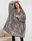 A warm and comfy unisex hooded sweatshirt perfect for winter wear and casual lounging.