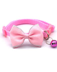 Bow and bell pet collar Fashionable pet accessory Stylish pet collar with bow Cute pet collar with bell Adorable pet collar design High-quality pet collar Durable pet collar for daily wear Pet fashion accessory Pet collar with charm Pet collar with bow and bell