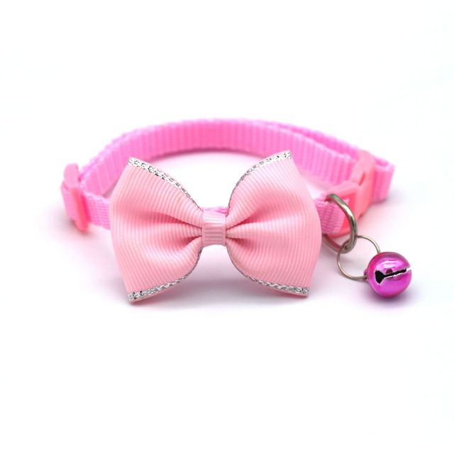 Bow and bell pet collar Fashionable pet accessory Stylish pet collar with bow Cute pet collar with bell Adorable pet collar design High-quality pet collar Durable pet collar for daily wear Pet fashion accessory Pet collar with charm Pet collar with bow and bell