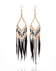 Tassels feather earrings Bohemian feather earrings Fringe feather earrings Statement feather earrings Boho chic earrings Long feather earrings Dangle tassel earrings Trendy feather earrings Fashionable tassel earrings Feather jewelry accessories