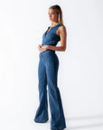 Heart cutout jumpsuit Backless jumpsuit Romantic jumpsuit Figure-flattering jumpsuit Special occasion attire Elegant jumpsuit Eye-catching outfit Fashion-forward jumpsuit Playful back detail Head-turning style