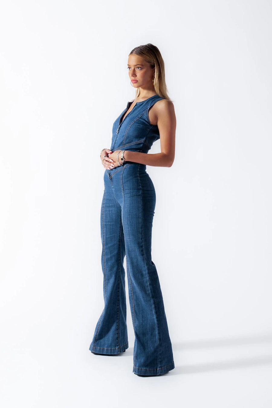 Heart cutout jumpsuit Backless jumpsuit Romantic jumpsuit Figure-flattering jumpsuit Special occasion attire Elegant jumpsuit Eye-catching outfit Fashion-forward jumpsuit Playful back detail Head-turning style