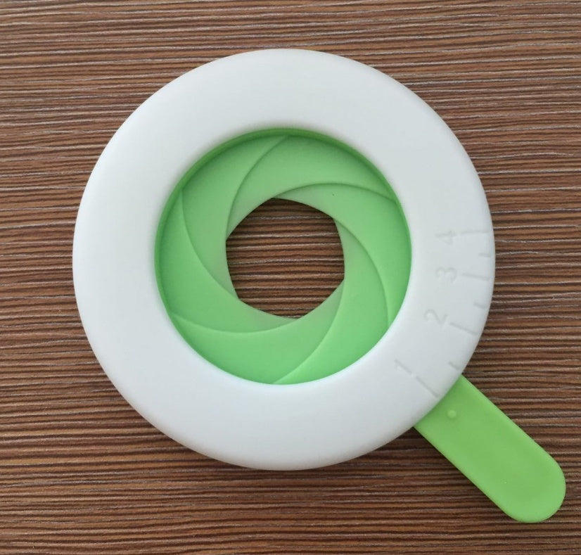 Close-up of a durable plastic spaghetti portion tool used for accurately measuring pasta portions, featuring a compact and easy-to-use design. Ideal as a pasta measuring tool, spaghetti measuring tool, spaghetti measurer, and versatile pasta measurer tool for home kitchens.