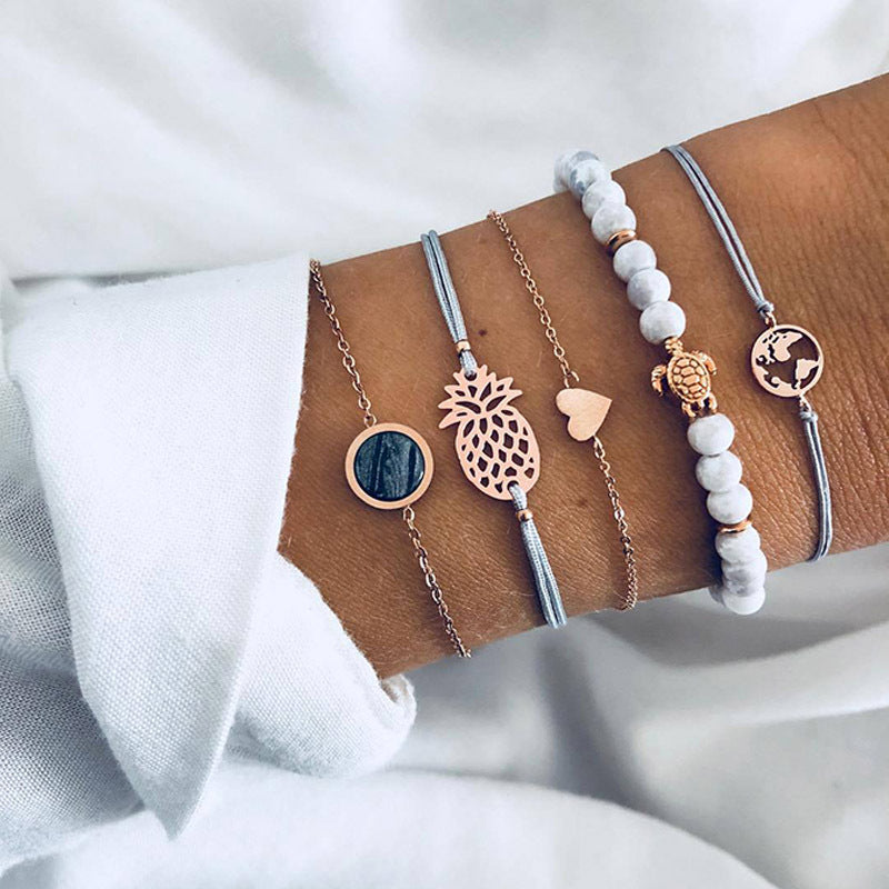 Elegant anklet bracelet featuring a star and moon design, with geometric, love, and flower elements. Includes turtle charm and beaded accents for a unique, boho-inspired look perfect for special occasions like weddings, anniversaries, and birthdays