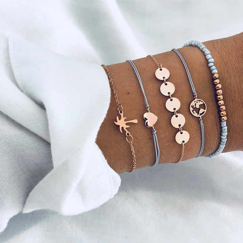 Elegant anklet bracelet featuring a star and moon design, with geometric, love, and flower elements. Includes turtle charm and beaded accents for a unique, boho-inspired look perfect for special occasions like weddings, anniversaries, and birthdays