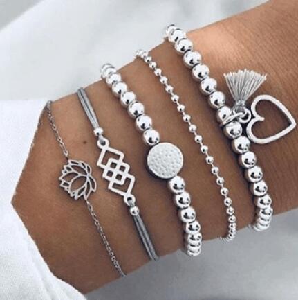 Elegant anklet bracelet featuring a star and moon design, with geometric, love, and flower elements. Includes turtle charm and beaded accents for a unique, boho-inspired look perfect for special occasions like weddings, anniversaries, and birthdays