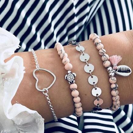 Elegant anklet bracelet featuring a star and moon design, with geometric, love, and flower elements. Includes turtle charm and beaded accents for a unique, boho-inspired look perfect for special occasions like weddings, anniversaries, and birthdays