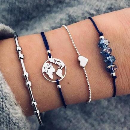 Elegant anklet bracelet featuring a star and moon design, with geometric, love, and flower elements. Includes turtle charm and beaded accents for a unique, boho-inspired look perfect for special occasions like weddings, anniversaries, and birthdays