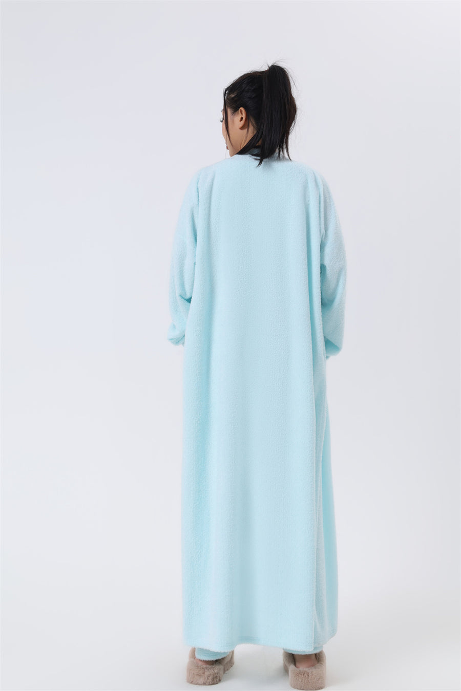 Cozy 3-piece pajama set for women, featuring a soft crop top, wide-leg pants, and a matching knee-length pullover in pastel colors.